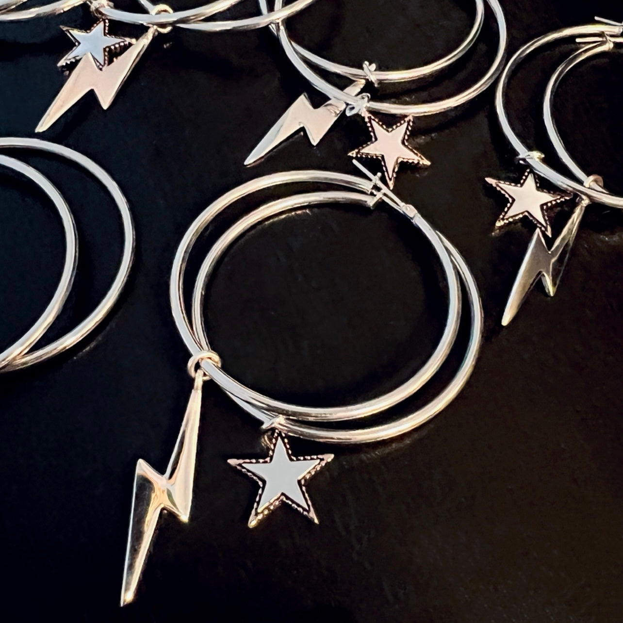 Sterling silver large hoop earrings with star and lightning bolt charms, mixed metal statement jewellery, Angel Rocks