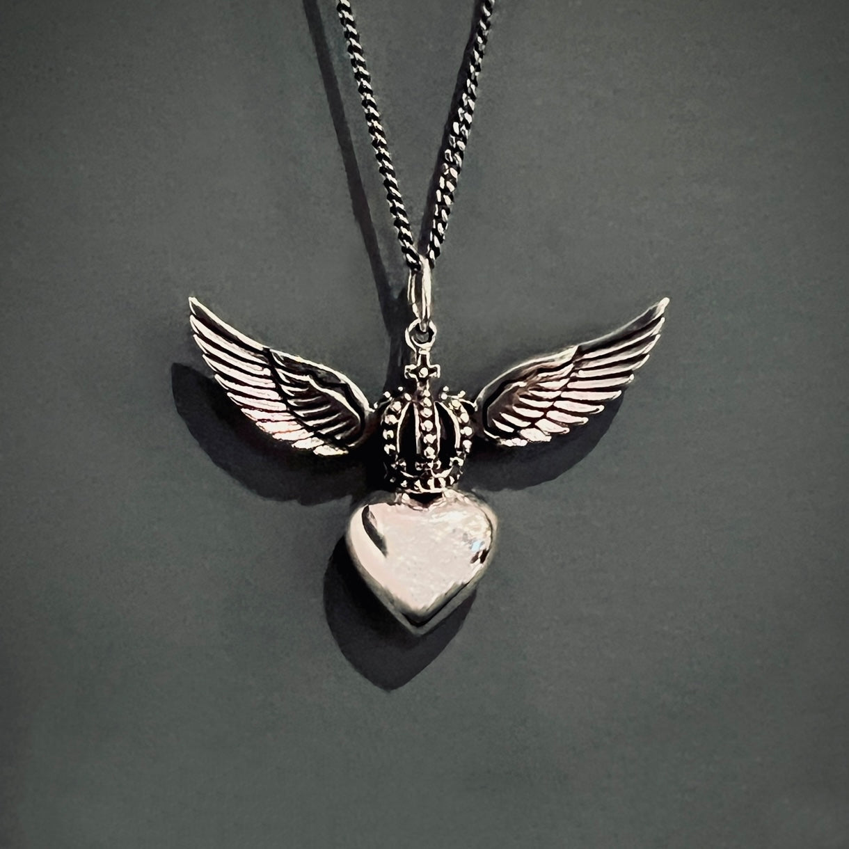 Sterling silver Divine Heart necklace with angel wings and crown pendant on adjustable snake chain, statement jewellery by Angel Rocks