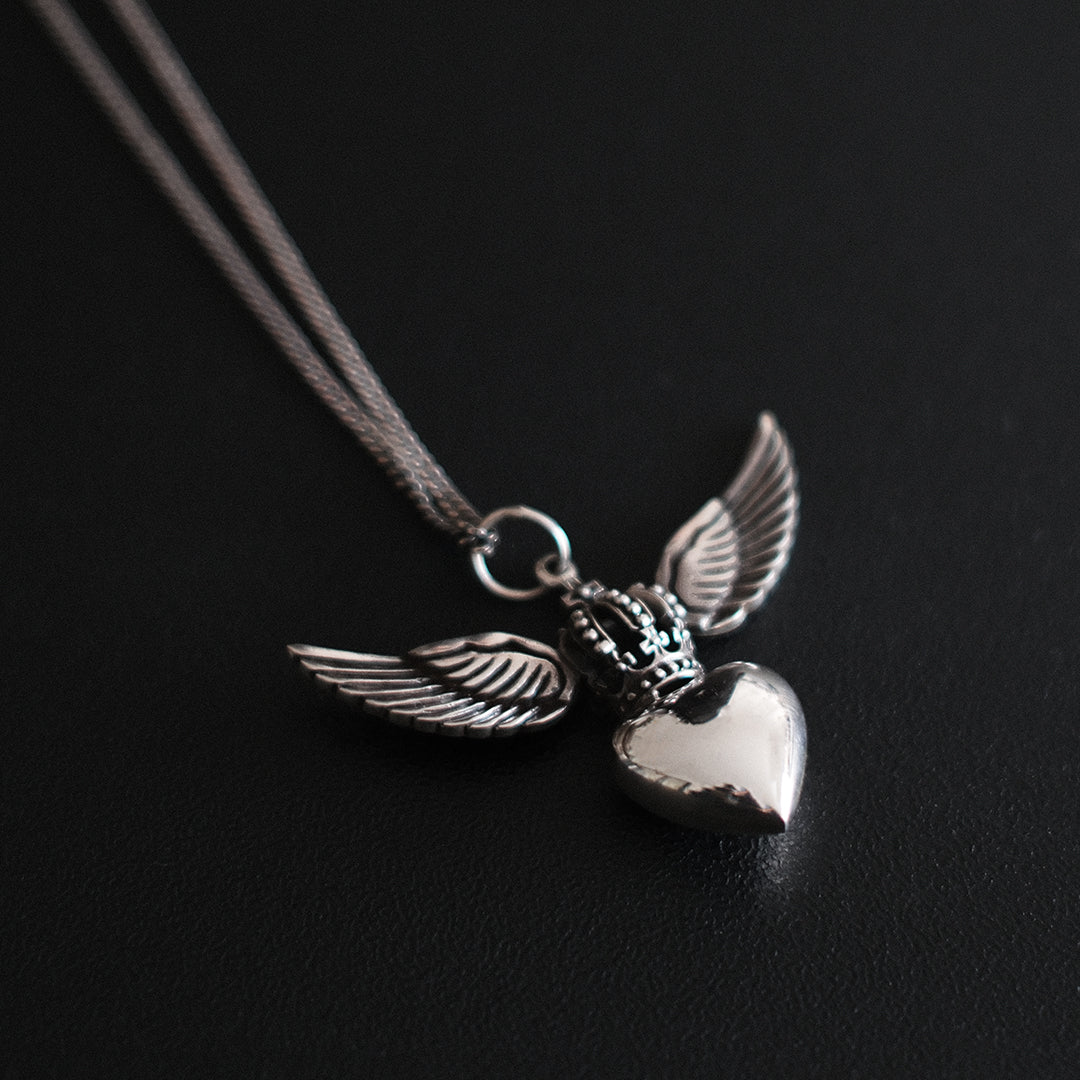 Sterling silver Divine Heart necklace with angel wings and crown pendant on adjustable snake chain, statement jewellery by Angel Rocks