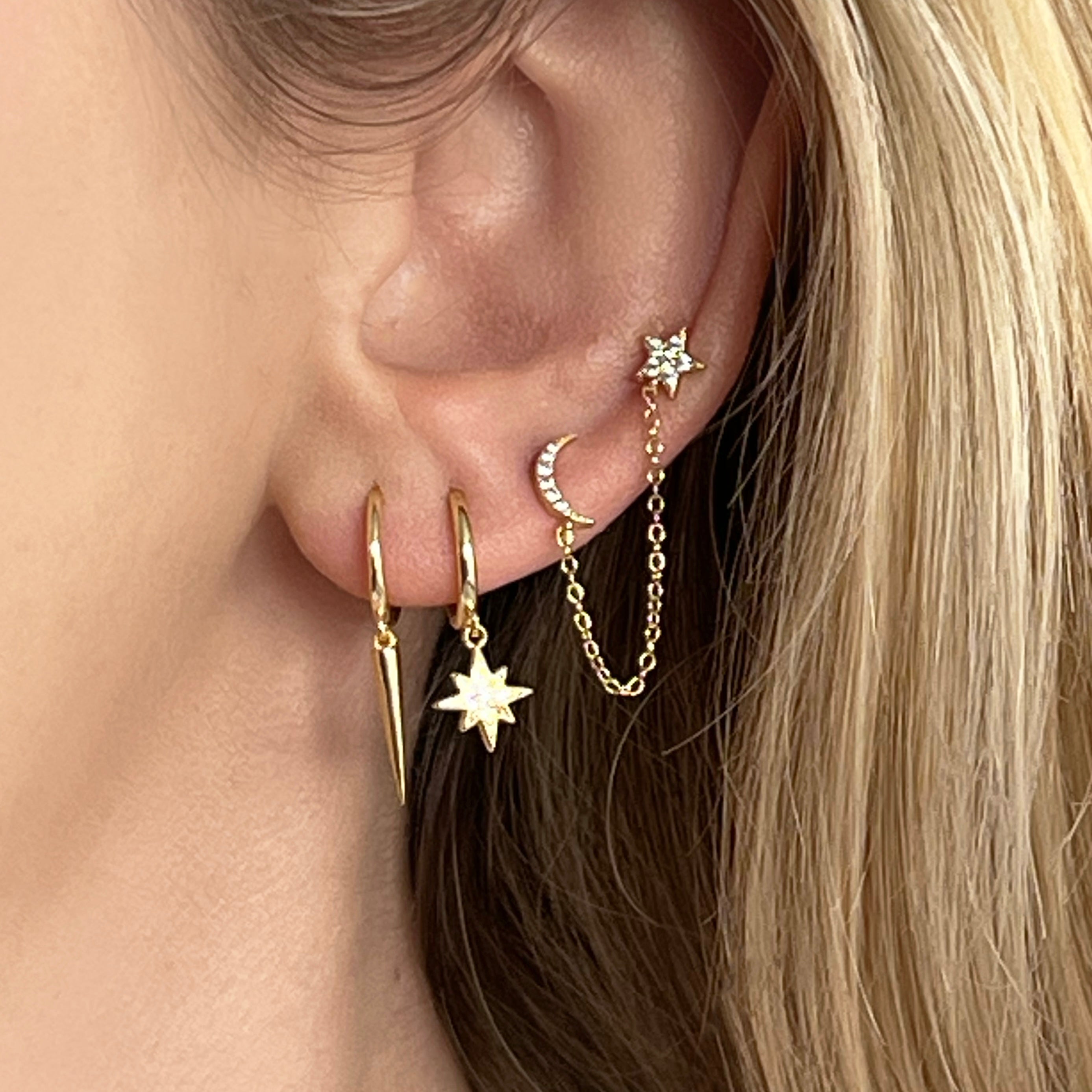 18kt gold plated sterling silver star and moon chain drop stud earrings with delicate diamanté detail and connecting chain for multiple piercings by Angel Rocks