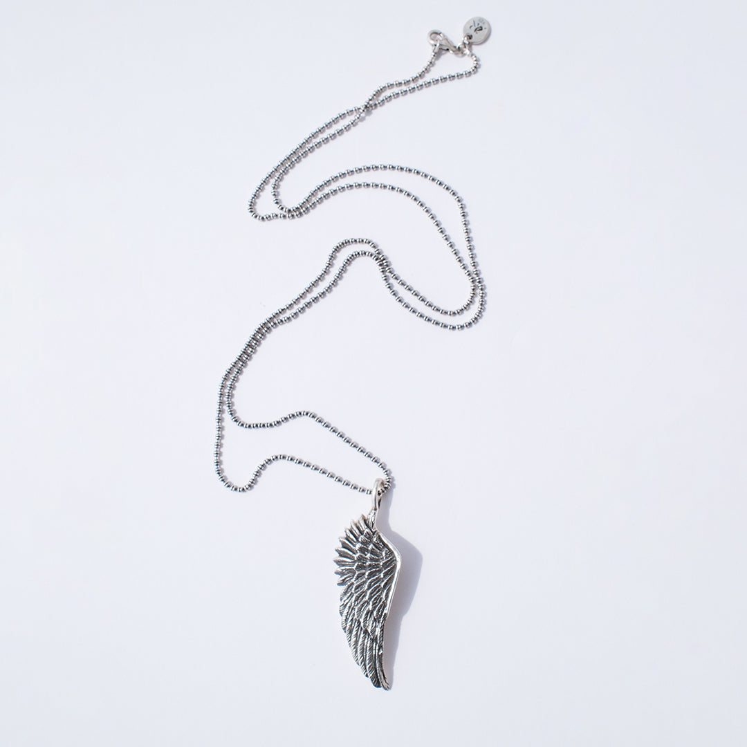 Handmade oxidised sterling silver angel wing pendant necklace on long chain by Angel Rocks