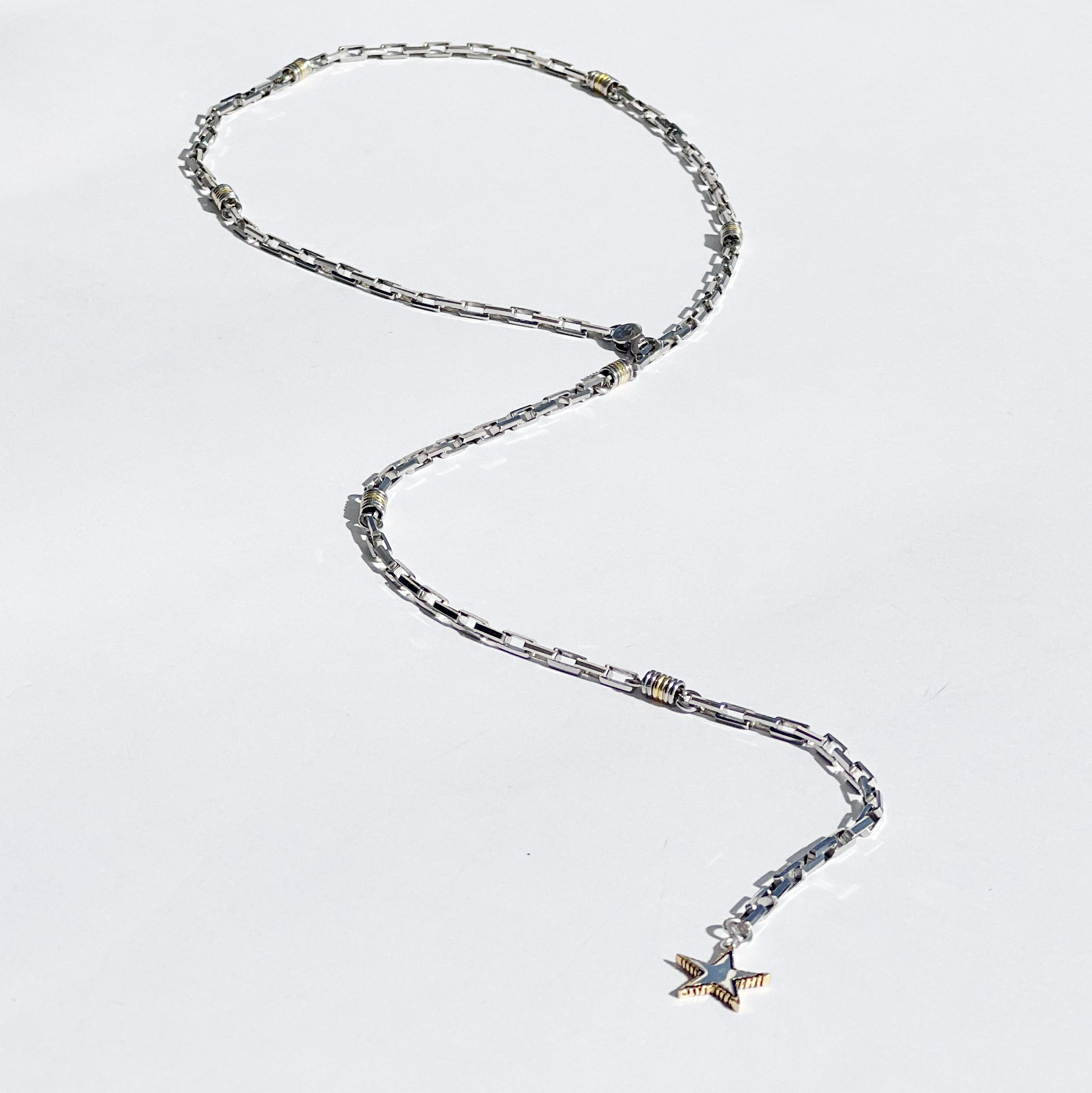 Rock Star lariat necklace with sterling silver chain, gold-edged star charm and adjustable long chain detail by Angel Rocks