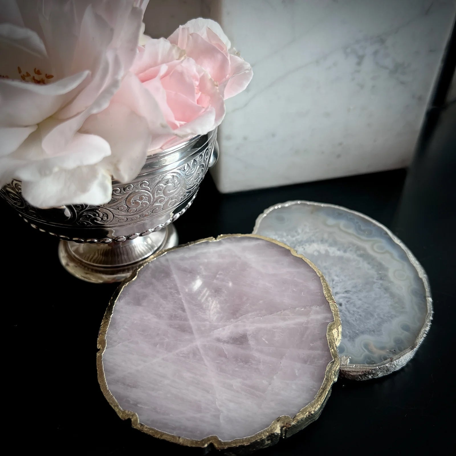 Rose quartz crystal coaster with gold edge detail, used as a candle stand or drinks mat by Angel Rocks