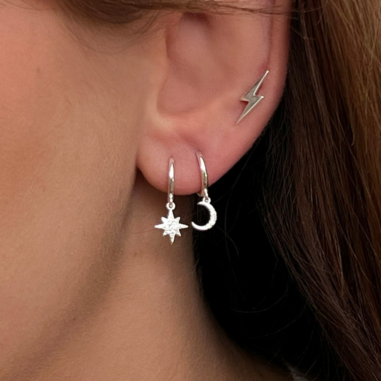 Sterling silver star and moon celestial huggie hoop earrings with cubic zirconia detail by Angel Rocks