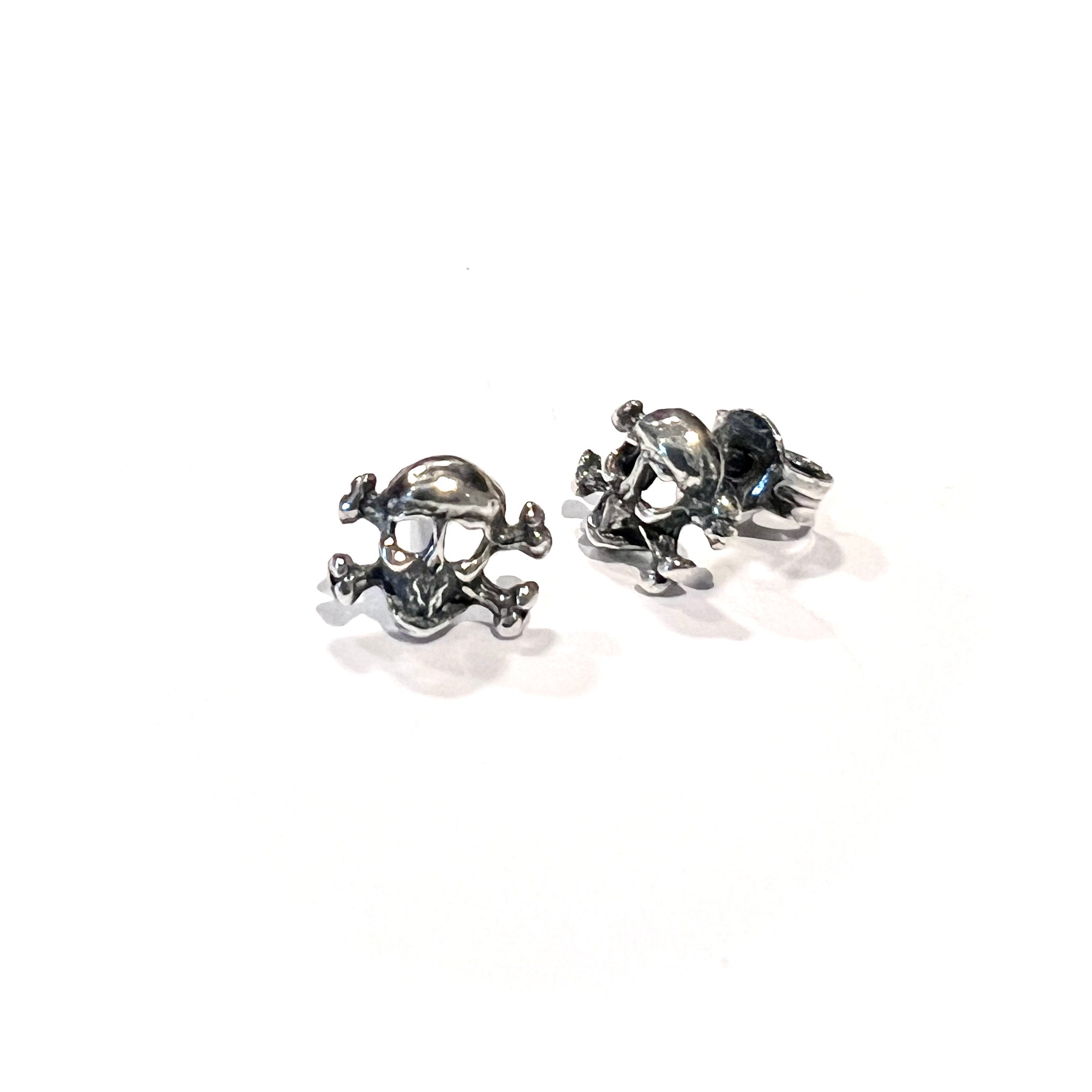 Sterling silver mini skull stud earrings with butterfly back fastening, handmade solid silver rock n roll style by Angel Rocks
