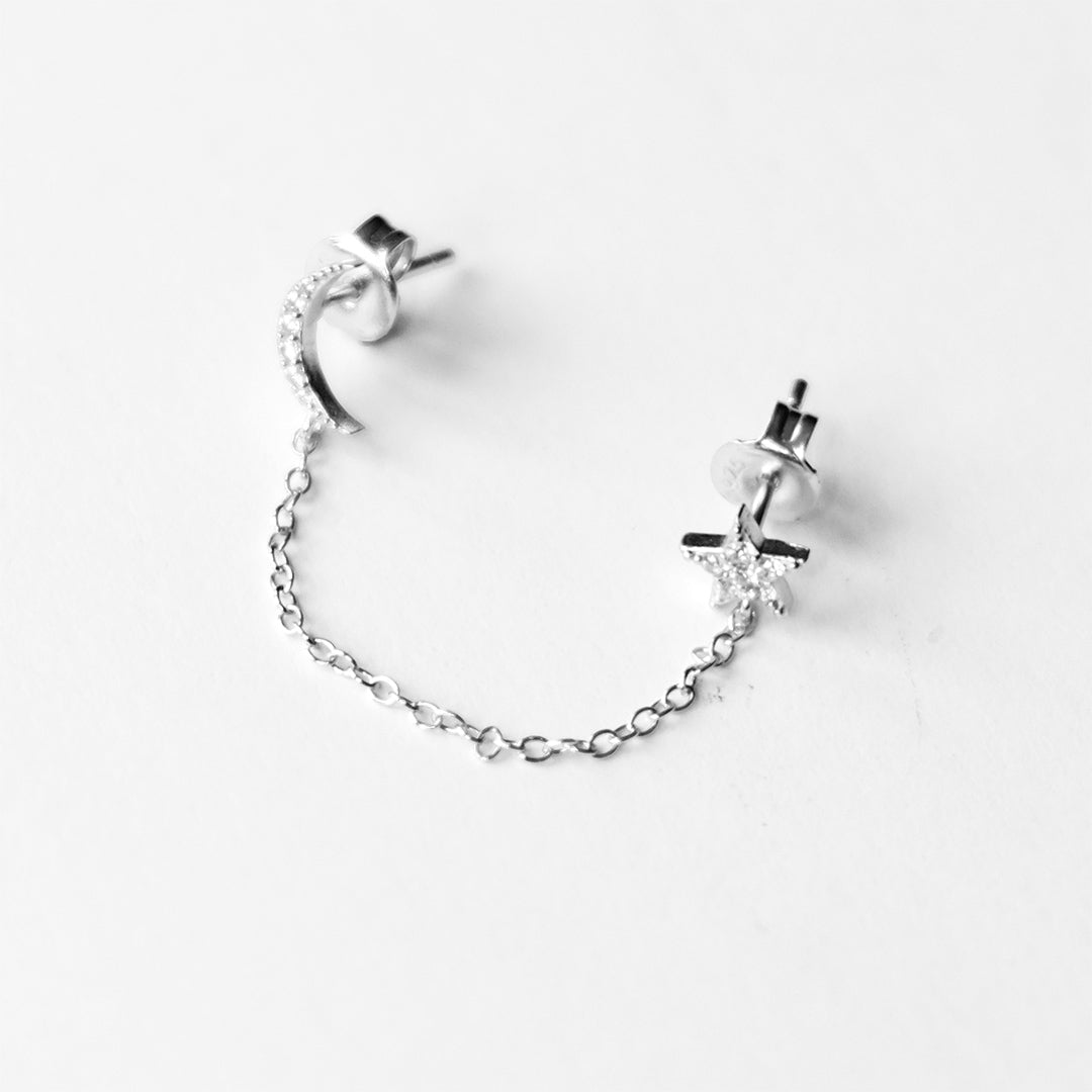 Sterling silver star and moon chain drop stud earrings with delicate diamanté detail and connecting chain for multiple piercings by Angel Rocks