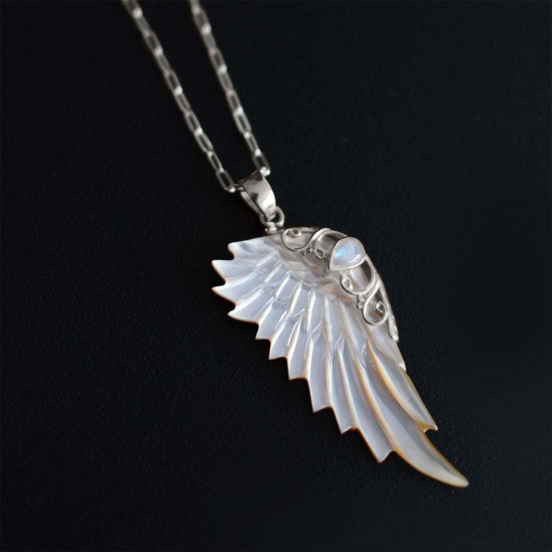 Sterling silver hand carved wing necklace with mother of pearl pendant and moonstone detail sterling silver chain, statement jewellery by Angel Rocks