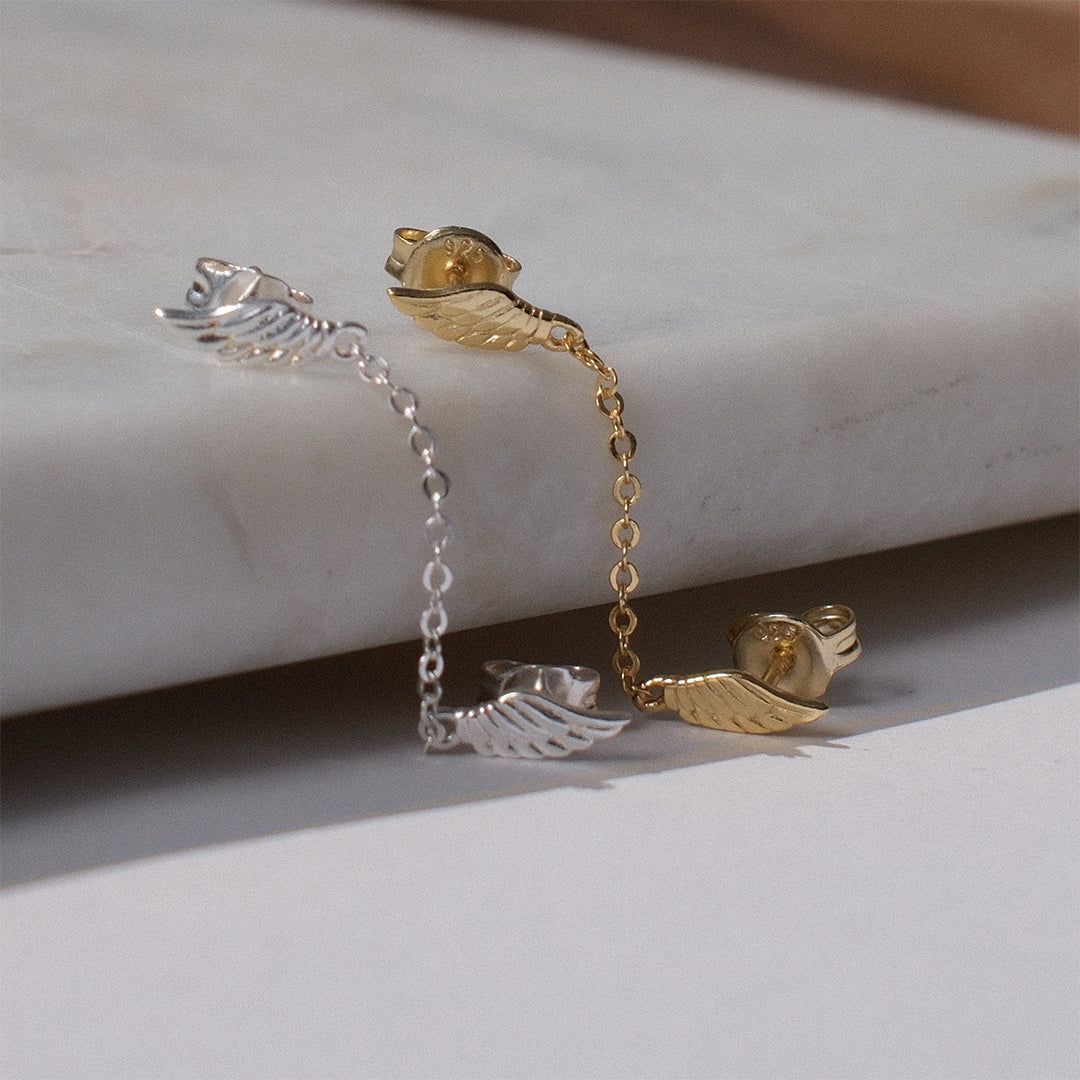 Sterling silver double wing chain stud earrings designed for multiple piercings with delicate connecting chain by Angel Rocks