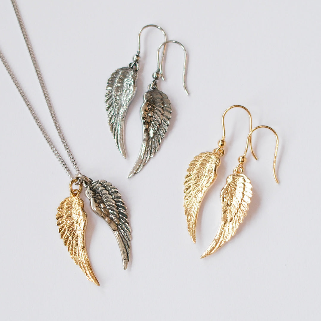 Pair of sterling silver and 18kt gold plated angel wing earrings, handmade wing design by Angel Rocks