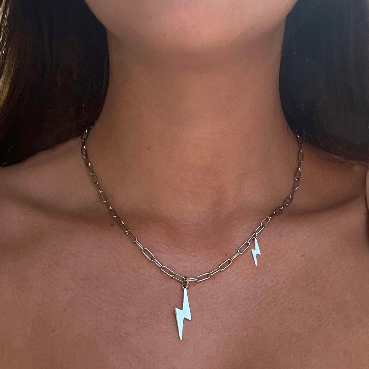 Sterling silver Bowie necklace with lightning bolt and mini charm pendants on adjustable chain by Angel Rocks