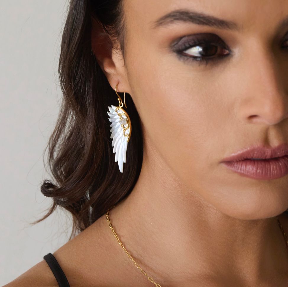 Hand carved mother of pearl angel wing earrings set in 18kt gold plated sterling silver by Angel Rocks