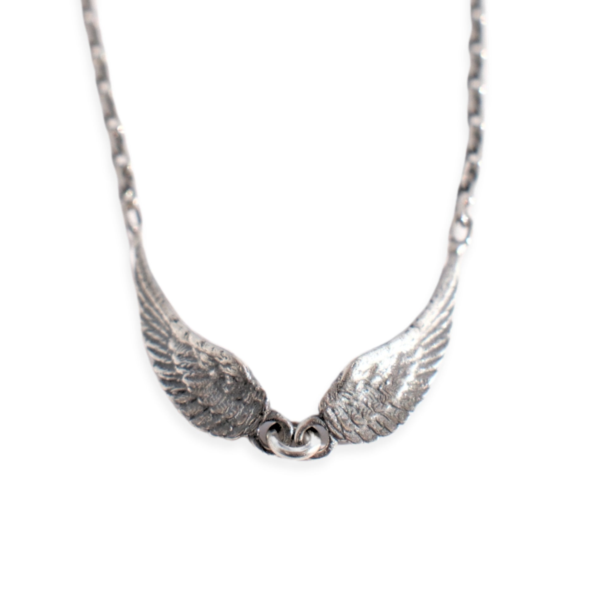 Sterling silver tiny angel wings necklace with small oxidised wing charms on adjustable fine chain by Angel Rocks