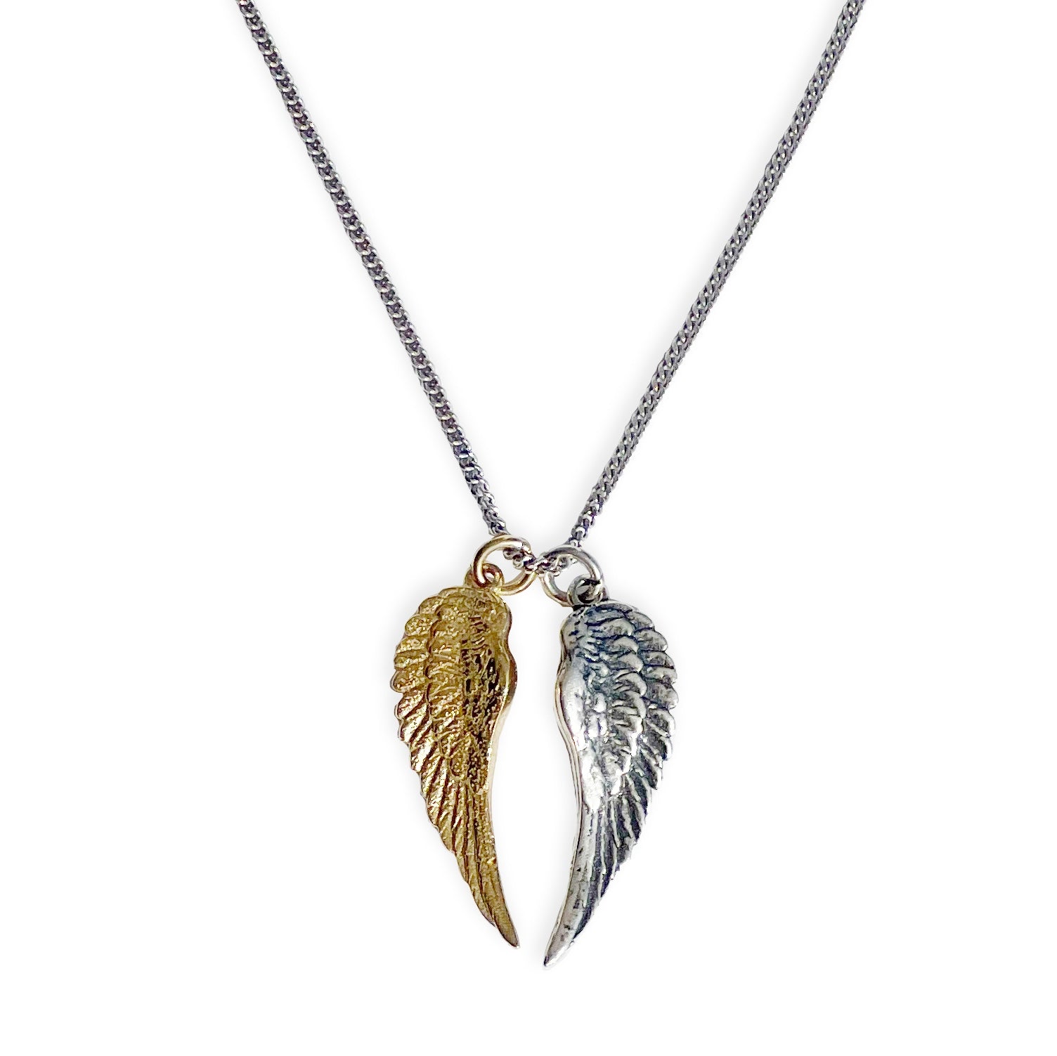 Pair of sterling silver and 18kt gold angel wing necklace with two separate wing charms on adjustable curb chain by Angel Rocks