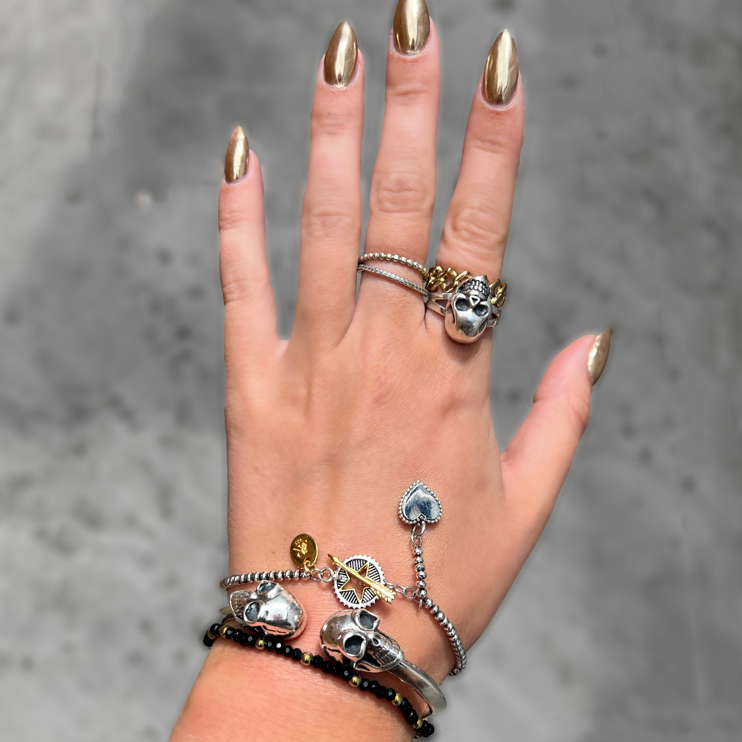 Sterling silver and 18kt gold Rock Star bracelet with star charm and arrow fastening detail by Angel Rocks