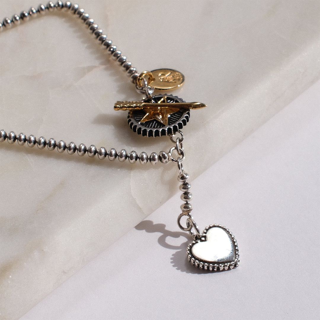 Sterling silver and 18kt gold Rock Star bracelet with star charm and arrow fastening detail by Angel Rocks