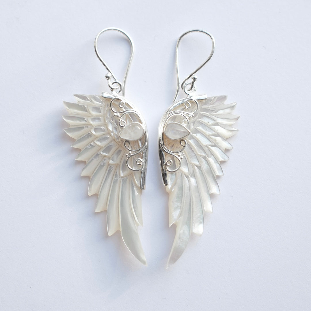 Hand carved mother of pearl angel wing earrings set in sterling silver by Angel Rocks