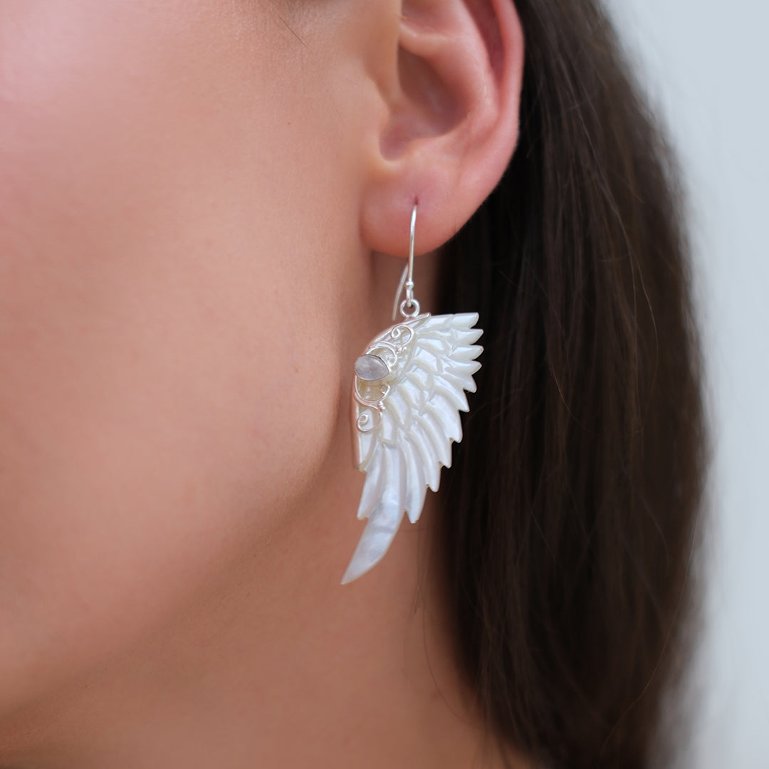 Hand carved mother of pearl angel wing earrings set in sterling silver by Angel Rocks