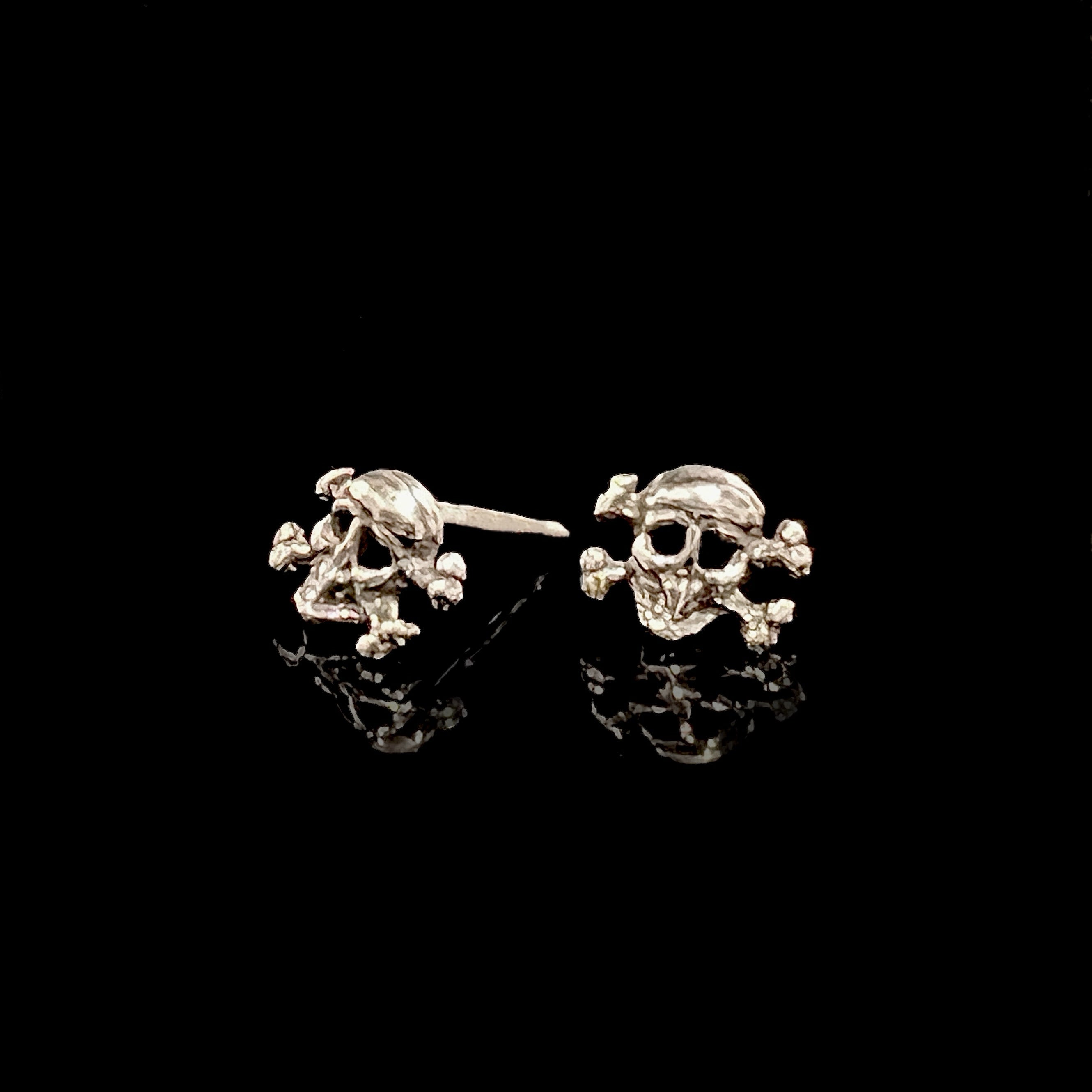Sterling silver mini skull stud earrings with butterfly back fastening, handmade solid silver rock n roll style by Angel Rocks