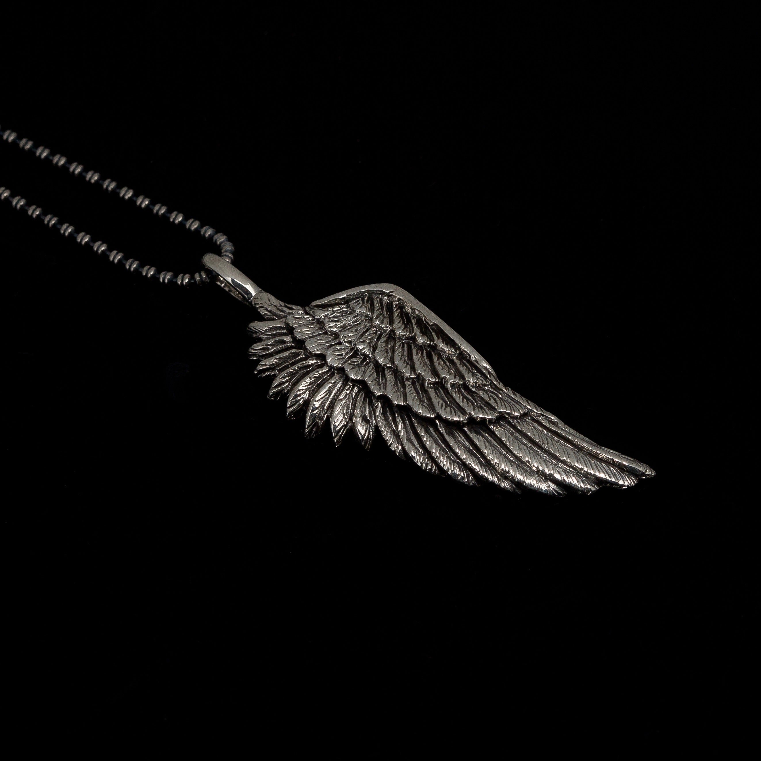 Handmade oxidised sterling silver angel wing pendant necklace on long chain by Angel Rocks